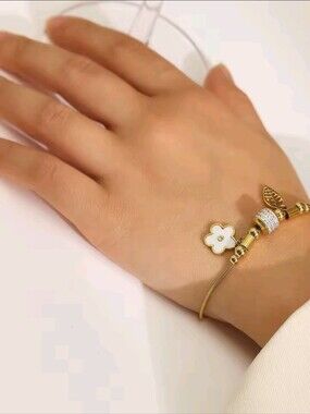 Gold Bracelet with White Floral Enamel Charm